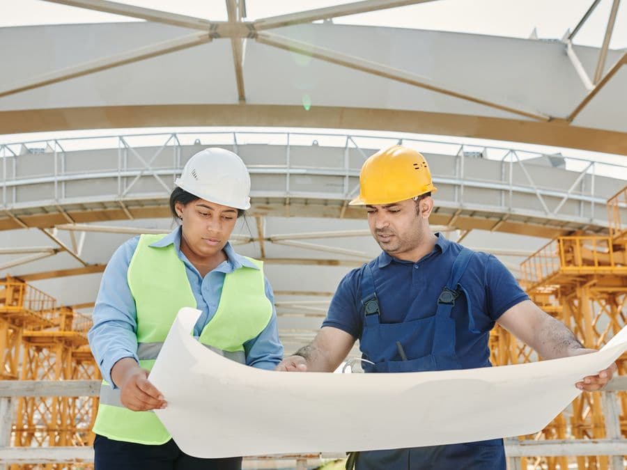 Site supervisor reviewing a property with a customer
